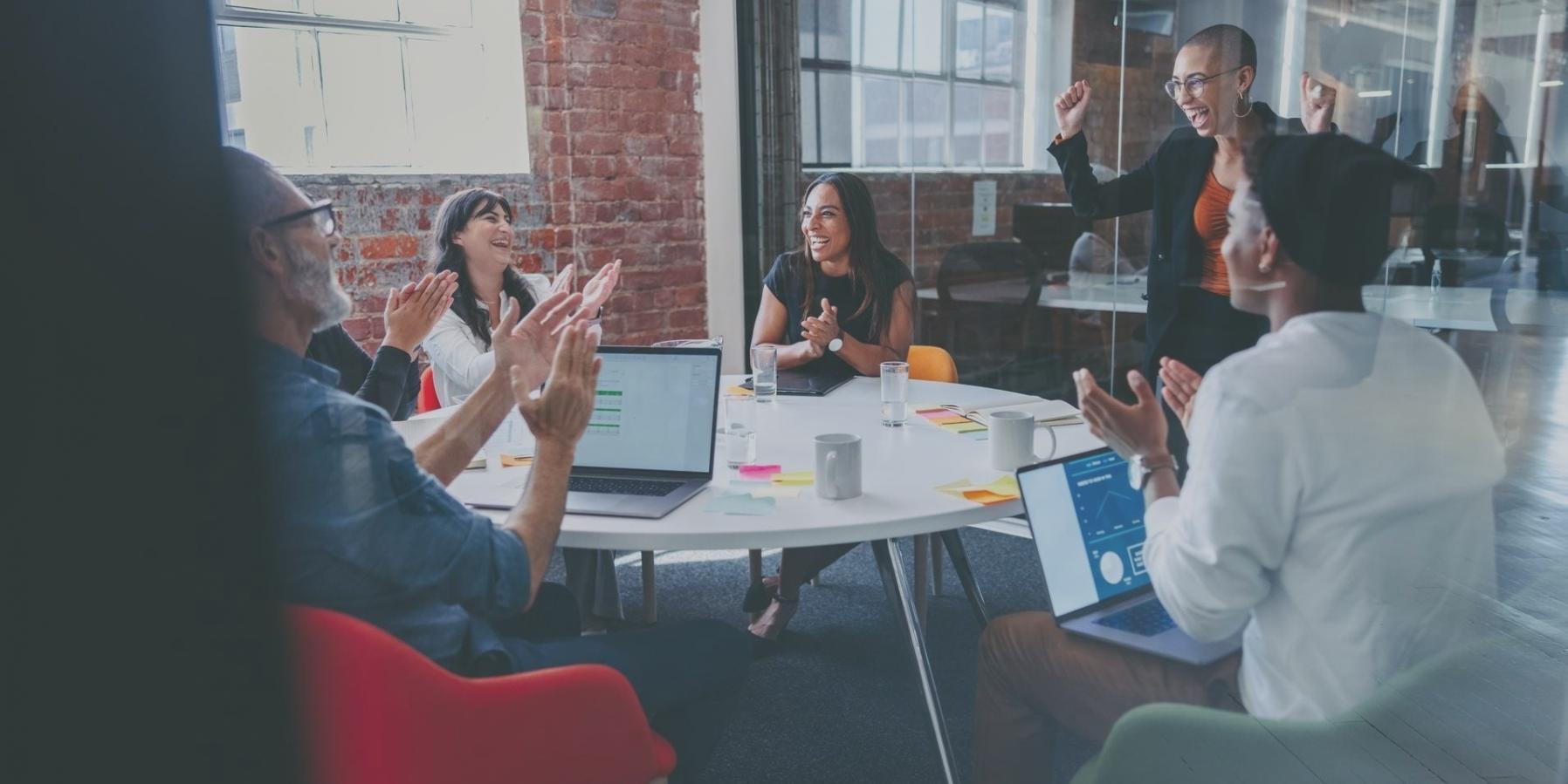 Family reviewing investment portfolio together at home with documents and laptop